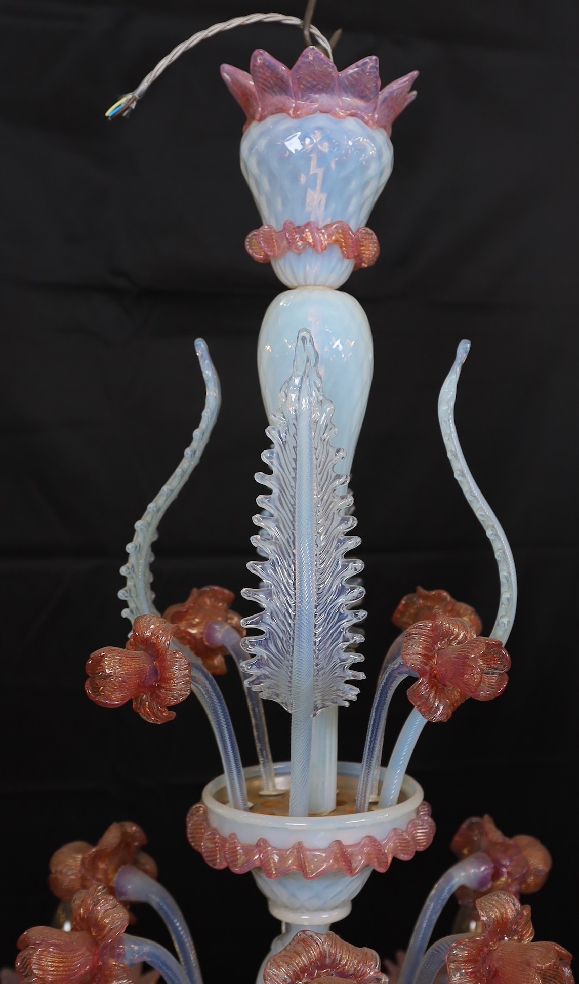 A 1950s Venetian pink and Vaseline glass six light chandelier with ornate flower and leaf motifs, height 90cm. width 70cm